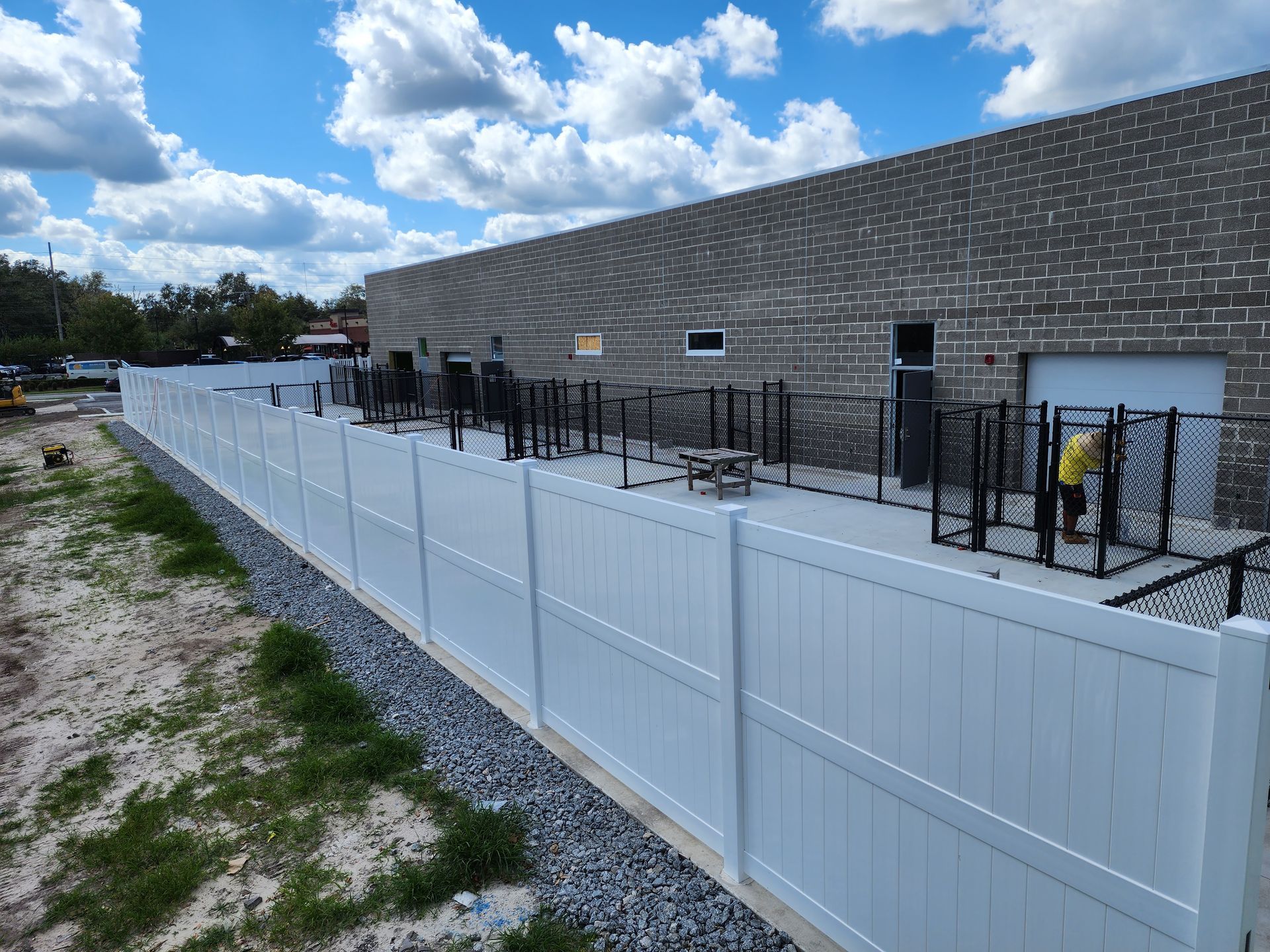 Commercial PVC/vinyl privacy fence around chain link fence pet suites in Valrico, FL