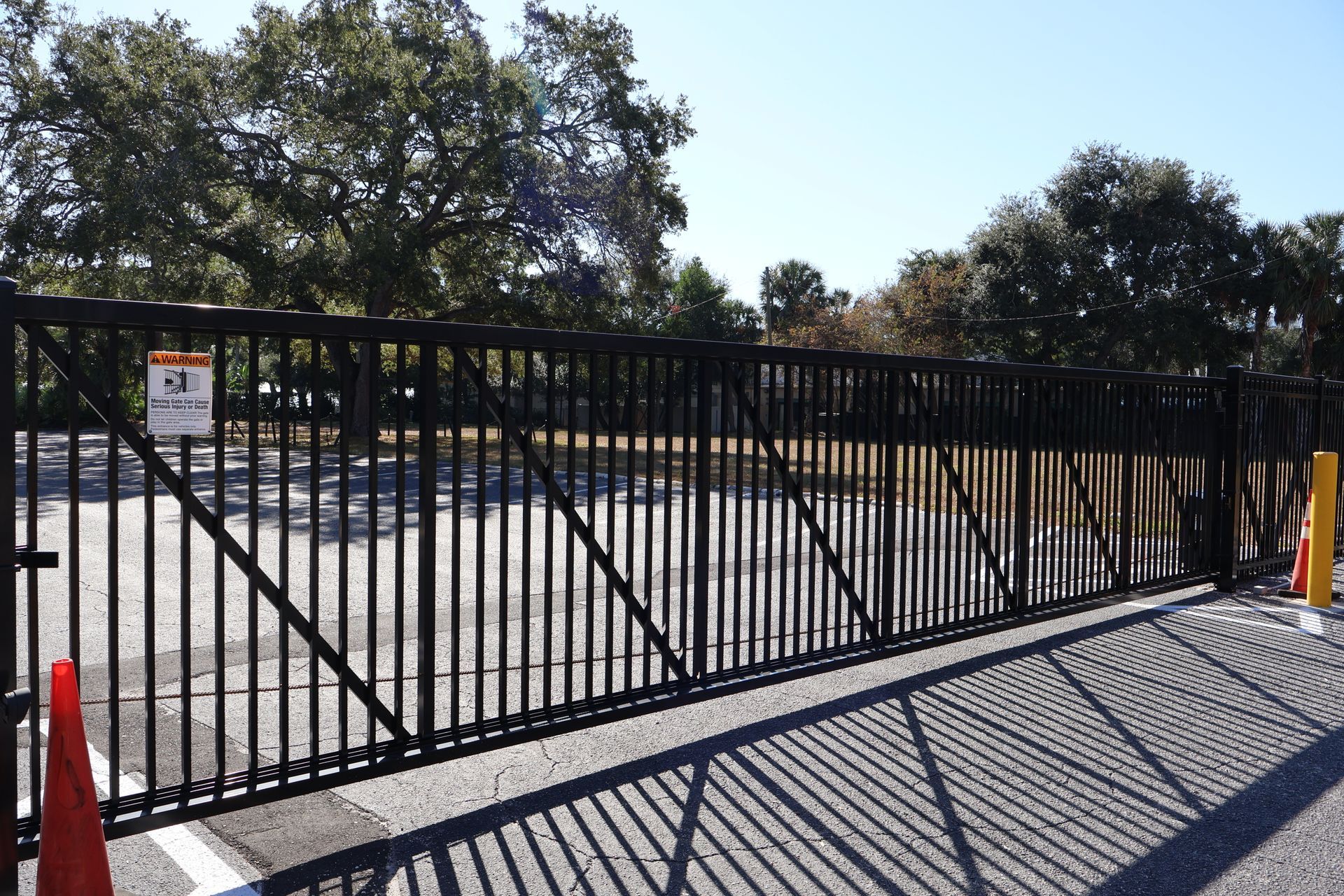 Commercial aluminum/steel automated gate and bollard installation in Tampa, FL