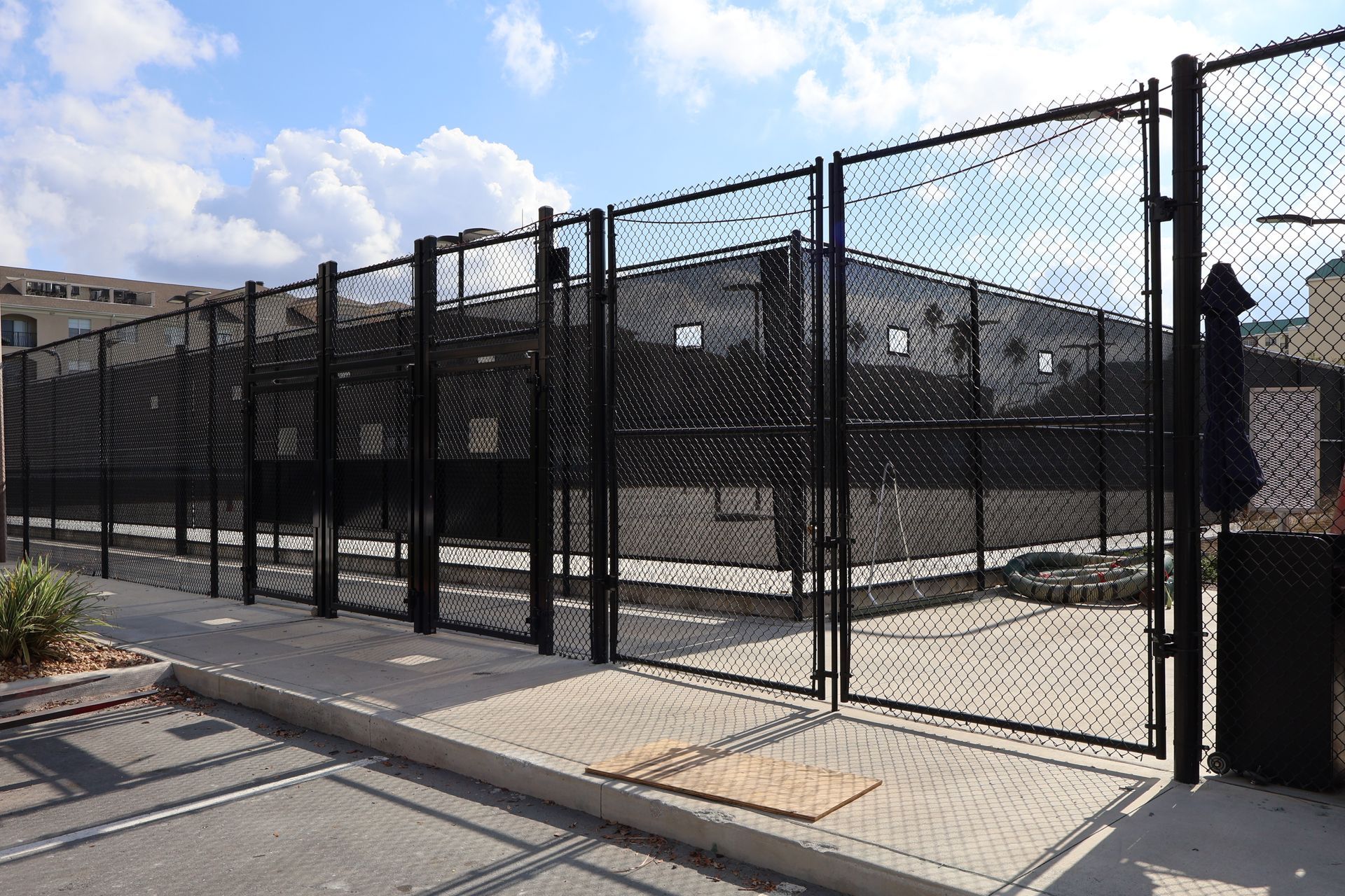 Commercial black chain link gate installation in Tampa, FL