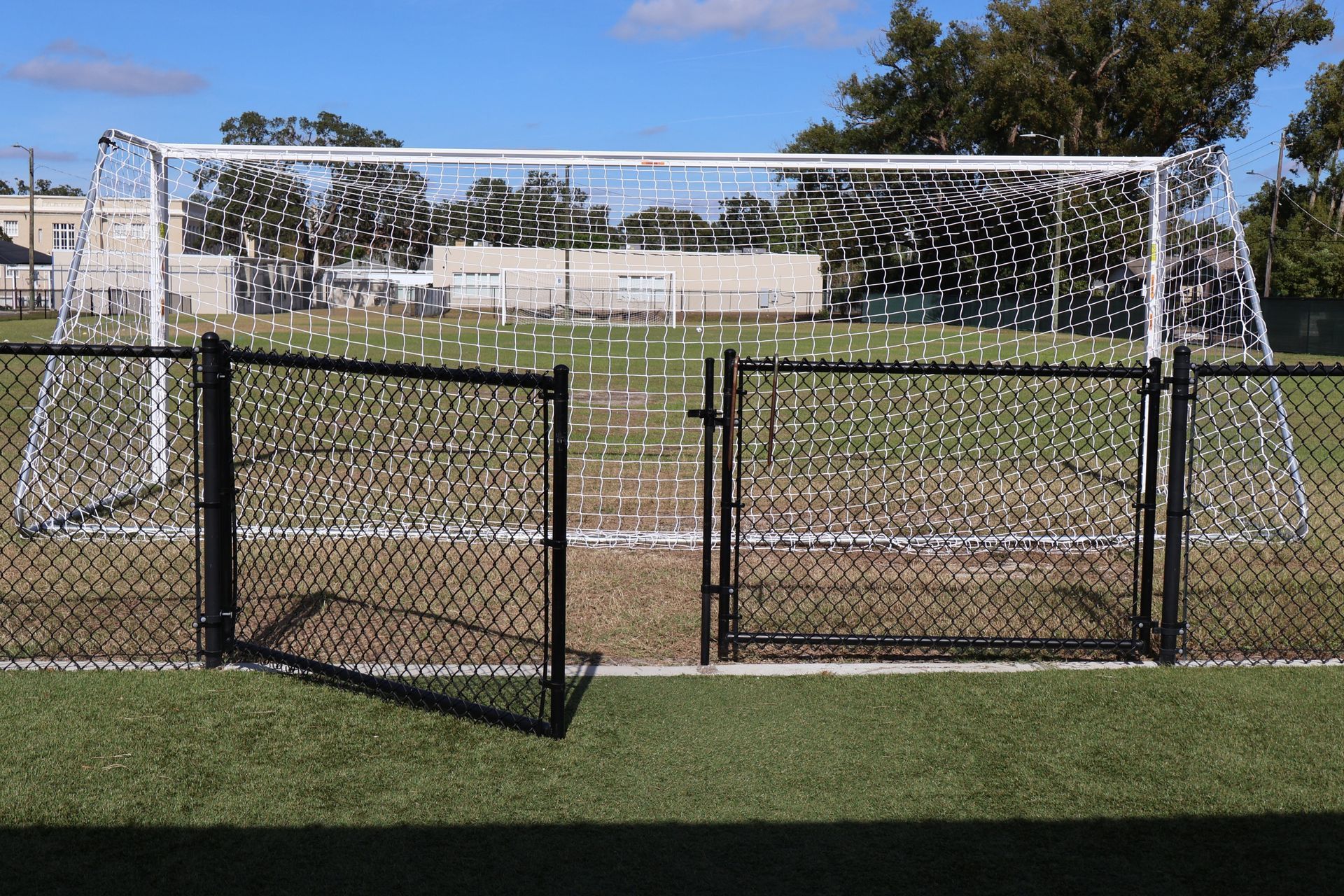 Commercial chain link fence with gate on a soccer field in Tampa, FL