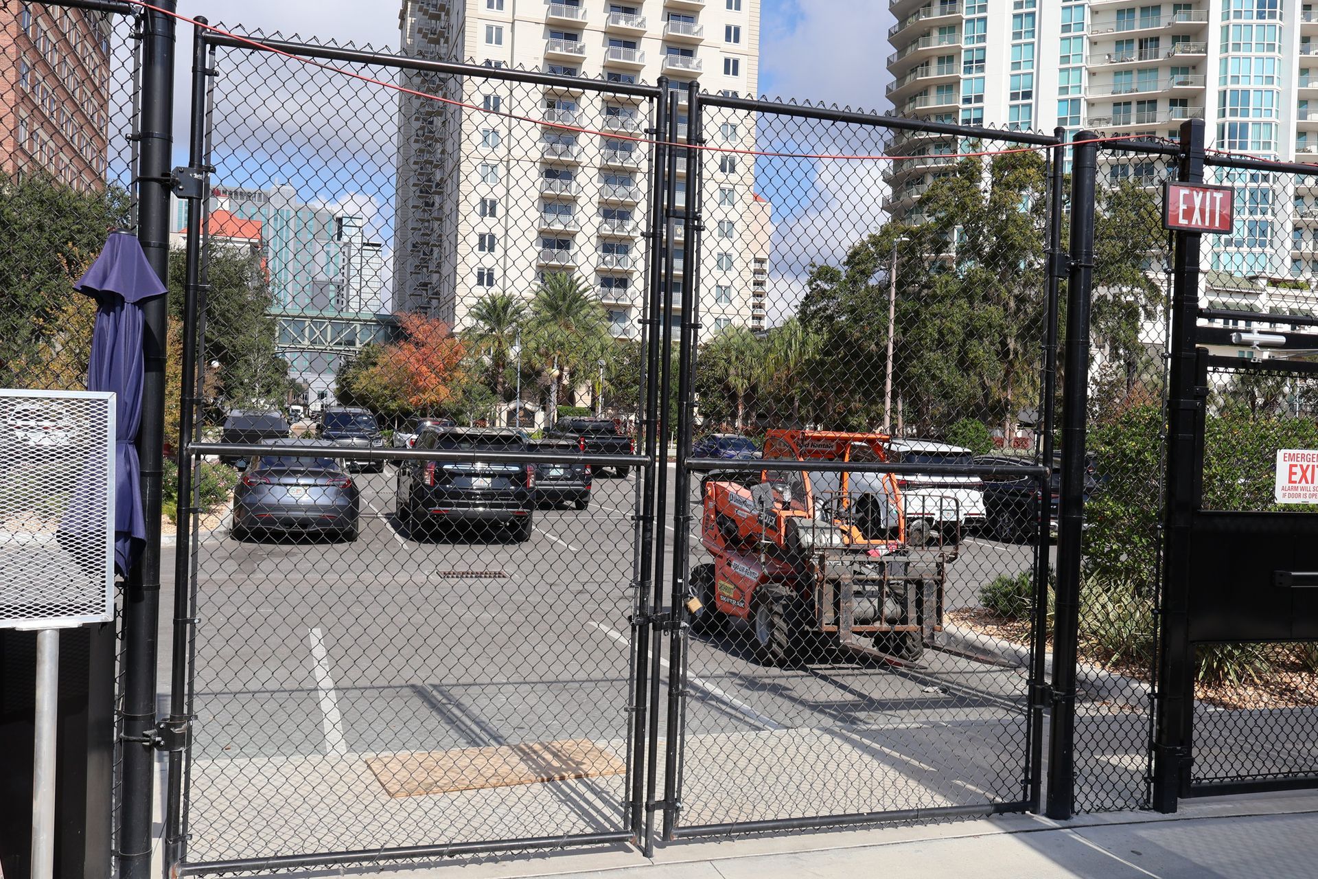 Commercial temporary chain link gate installation in a parking lot in Tampa, FL