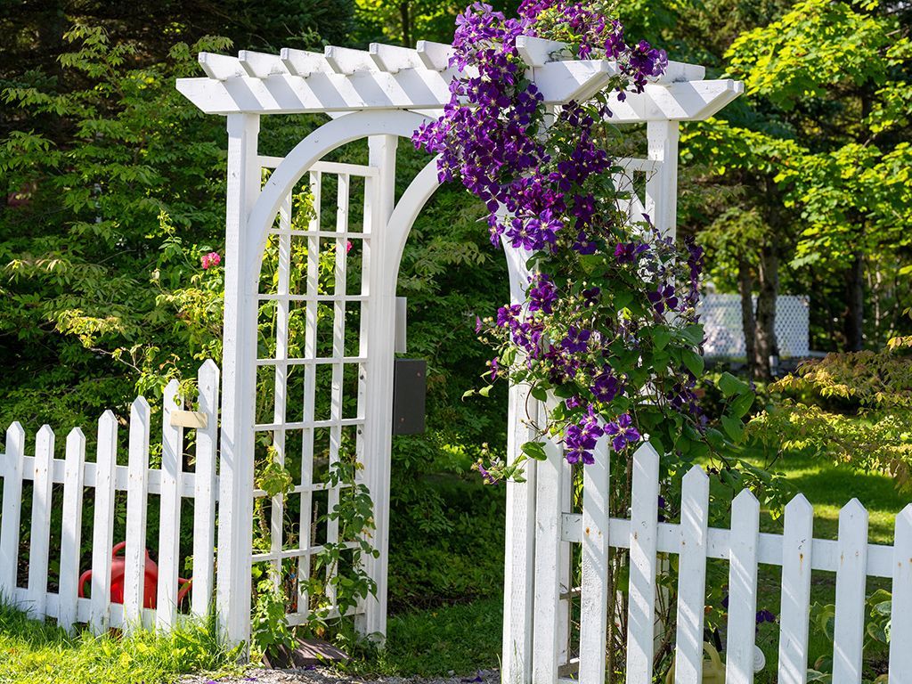 White Residential vinyl arbor installation in Tampa, FL