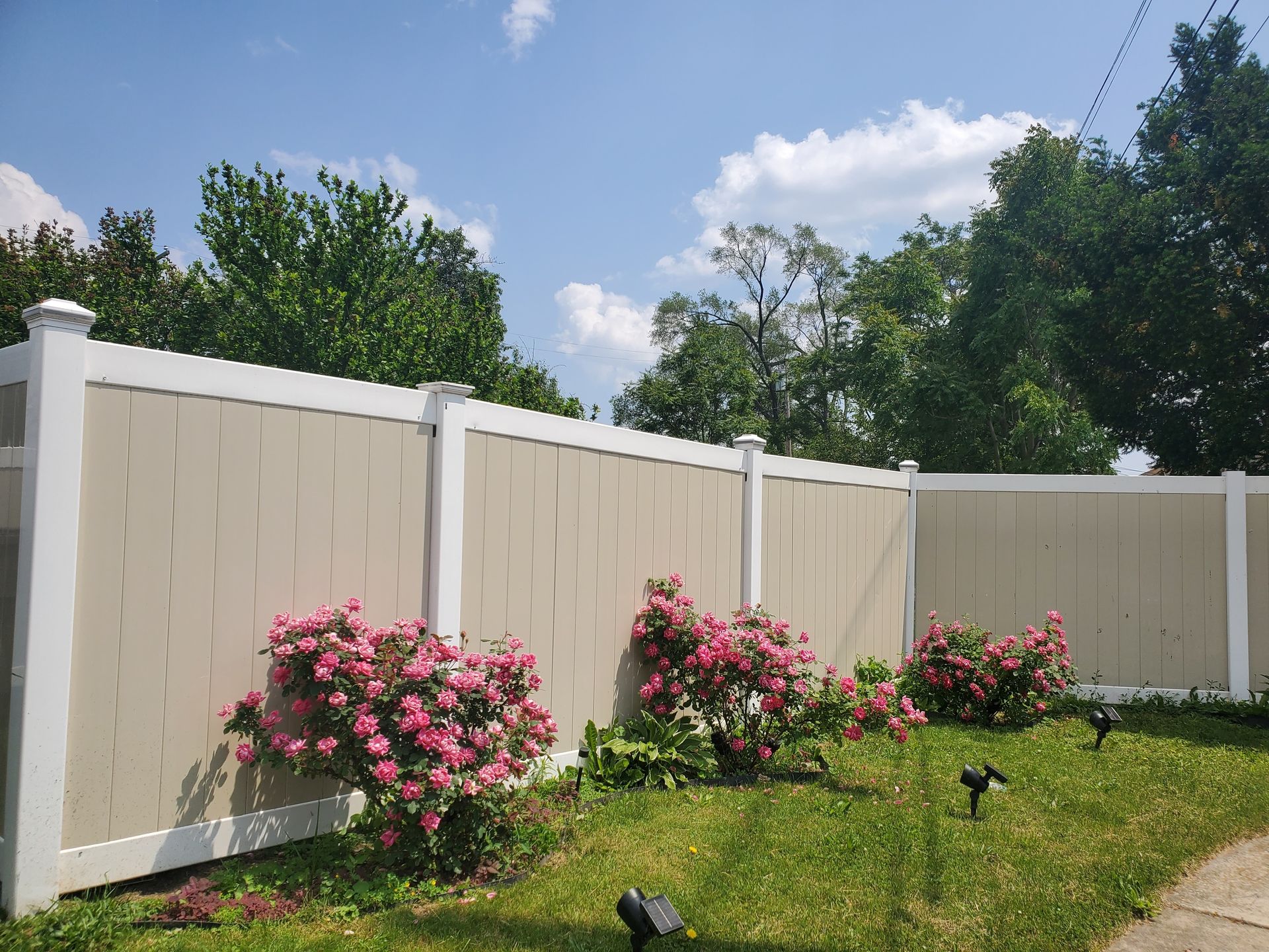Residential mixed material vinyl fence installation in Tampa, FL