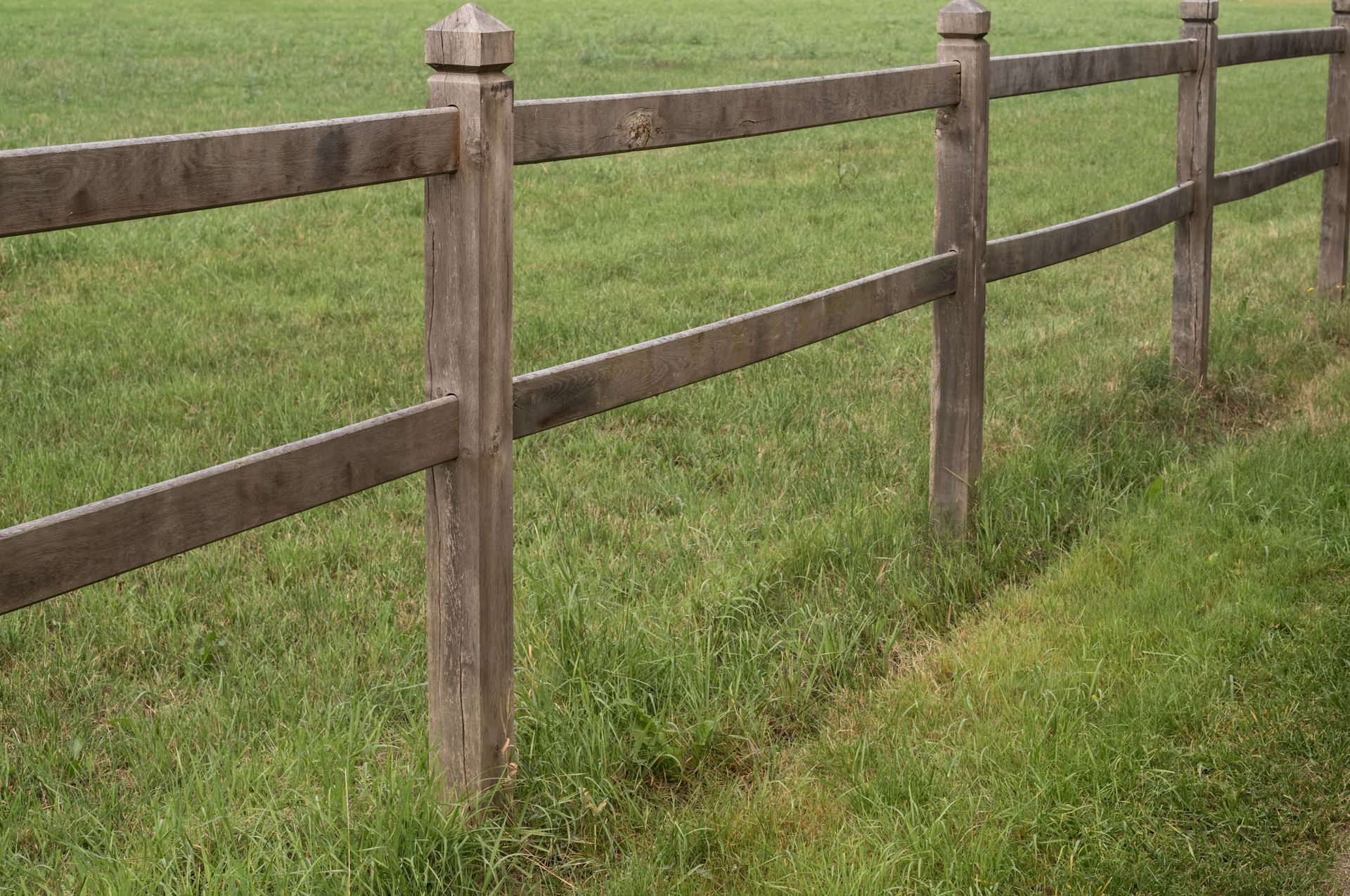 Residential wood split rail fence installation in Tampa, FL