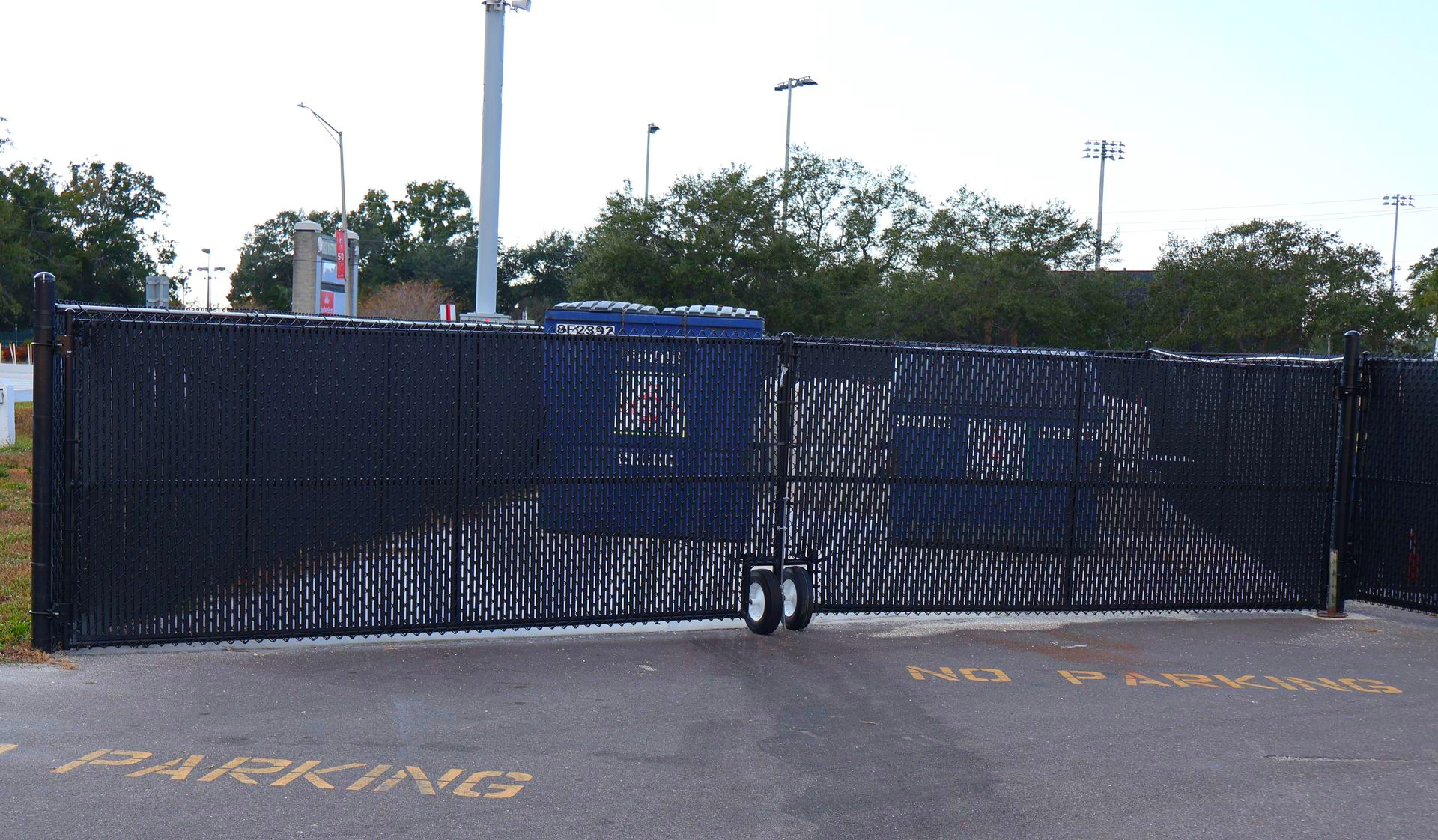 Commercial chain link dumpster enclosure in Tampa, FL