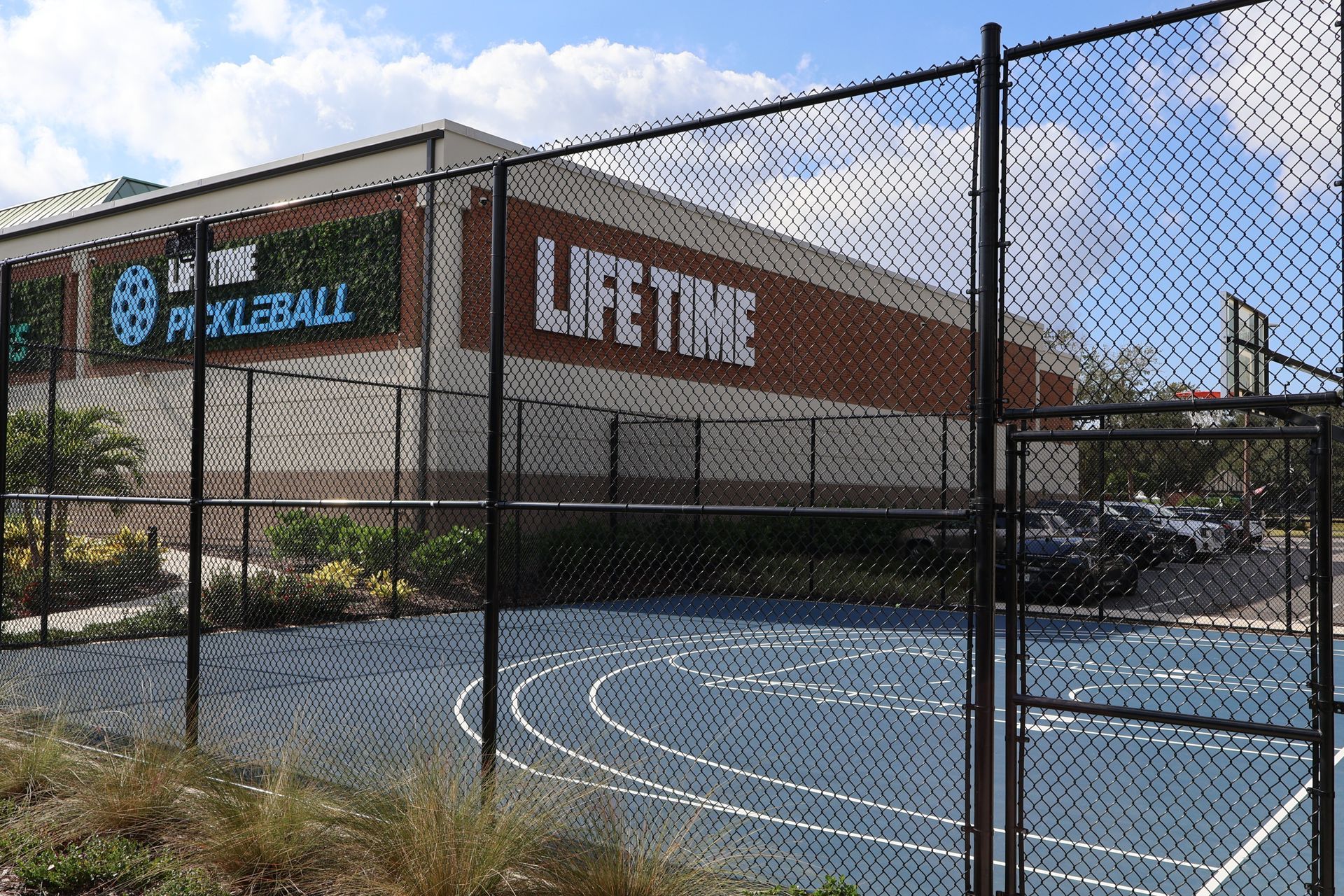 Commercial chain link fence installation around Life Time Pickleball Court in Tampa, FL