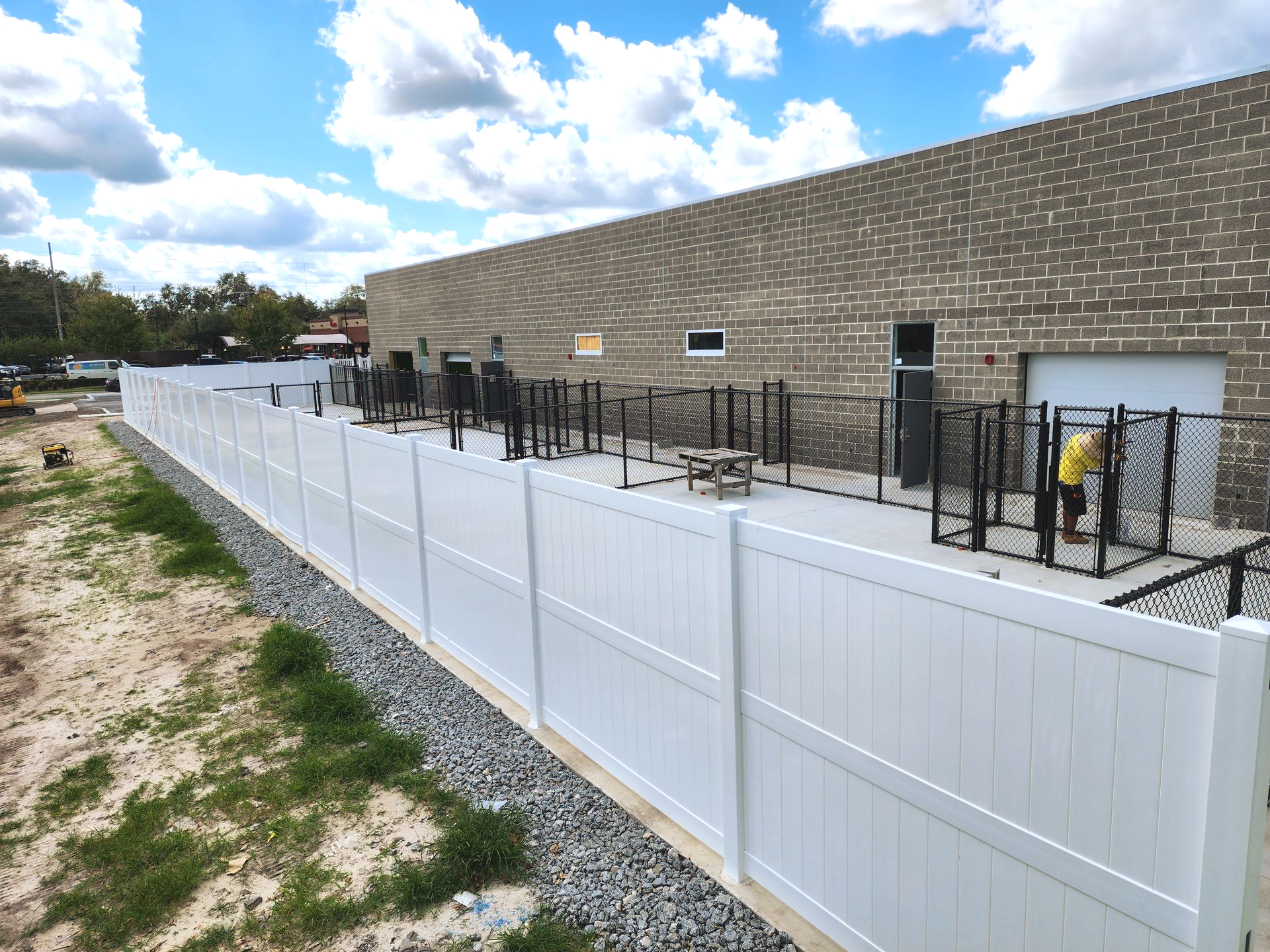 Commercial vinyl privacy fence installation in Tampa, FL