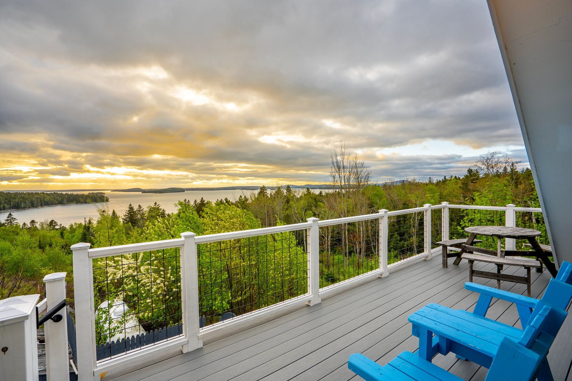 View from the deck at Bluff House Inn overlooking Frenchman Bay on the quiet side of Acadia at sunset.
