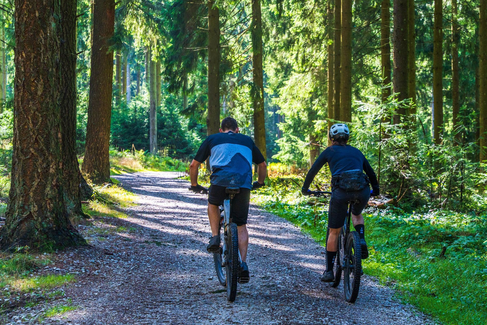 2 bikers biking on gravel trails in Acadia National Park