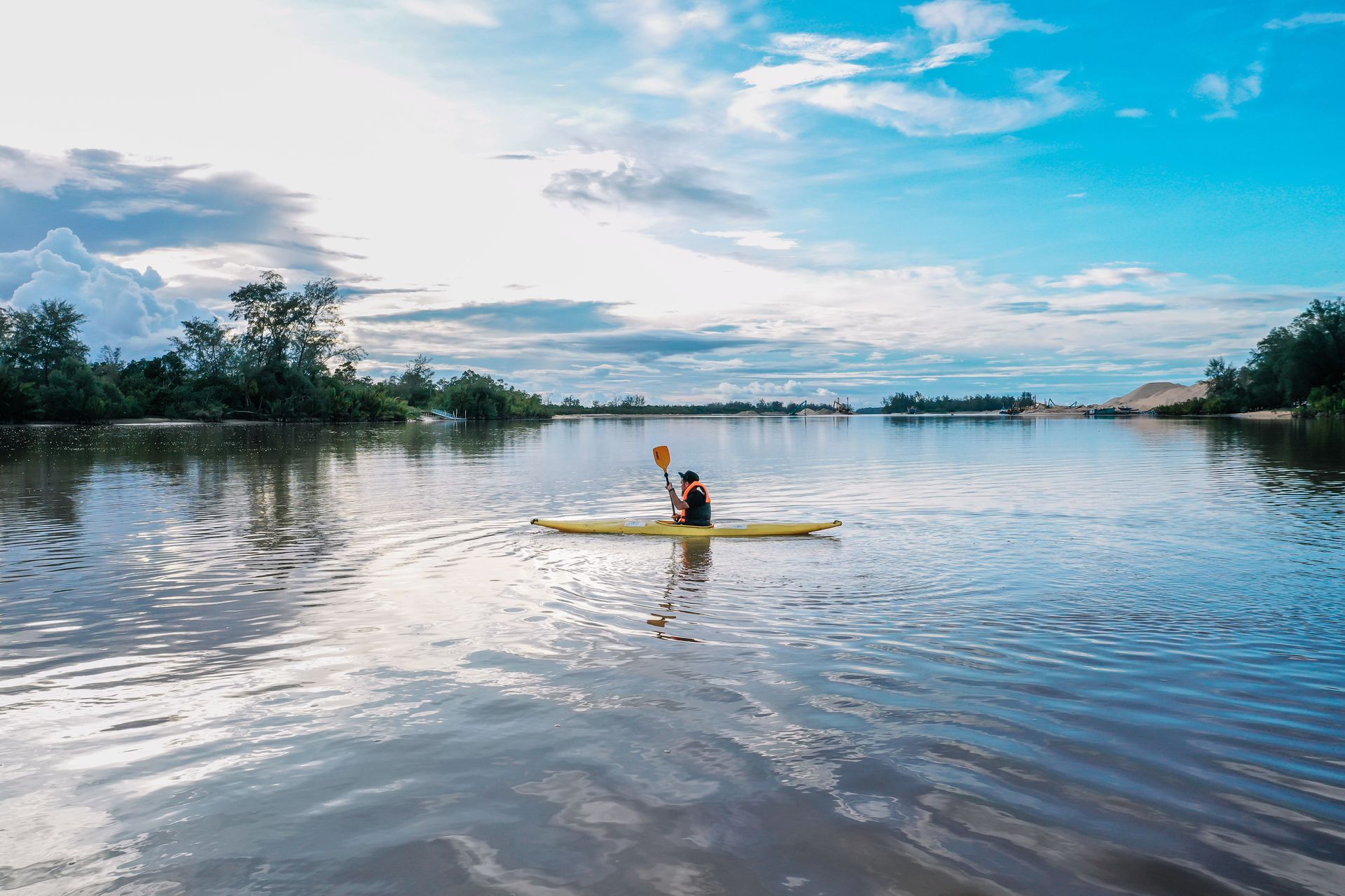 A kayaker in the middle of Jones Pond near the Bluff House Inn on the quiet side of Acadia.