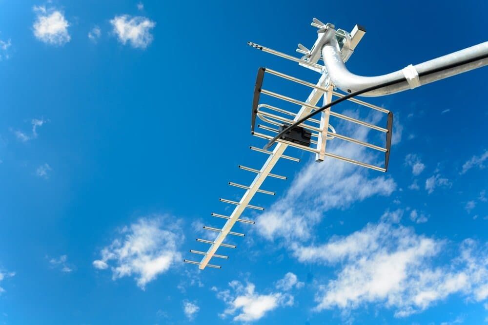 An Antenna Is Hanging From A Pole In The Sky — Coastwide Antennas In Terrigal, NSW