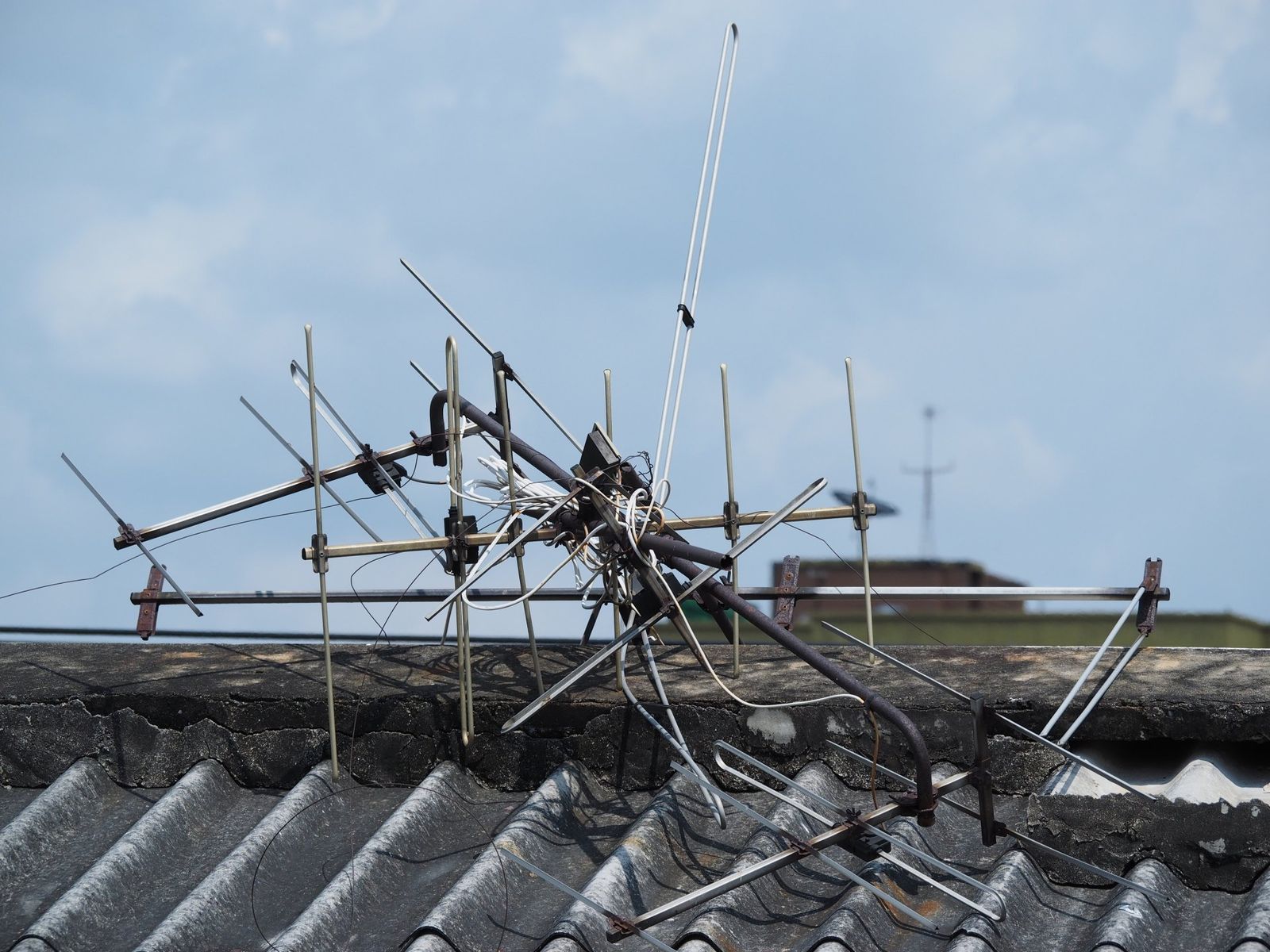 A Broken Antenna Is Sitting On Top Of A Roof — Coastwide Antennas In Ourimbah, NSW