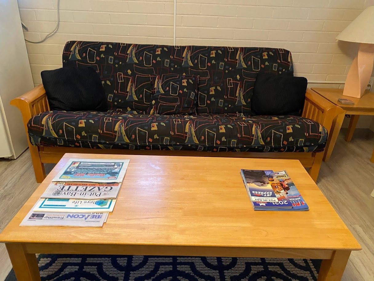 A living room with a couch and a coffee table.