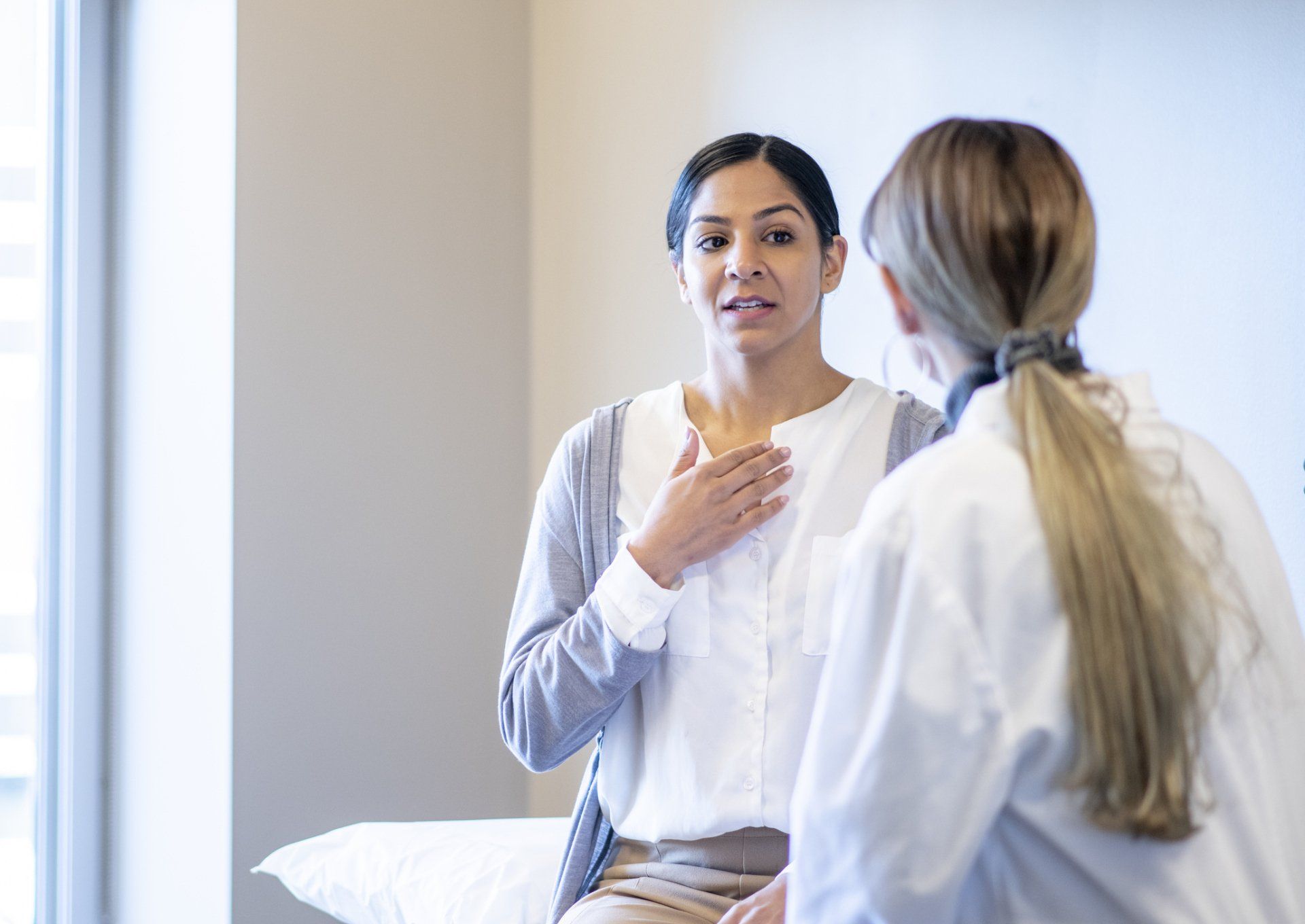 Woman talking to a doctor — New Hartford, NY — Oxford Medical Imaging