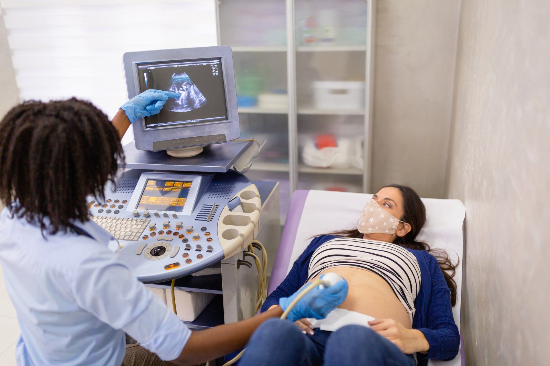 Female doctor doing ultrasound examination of a pregnant woman — New Hartford, NY — Oxford Medical Imaging