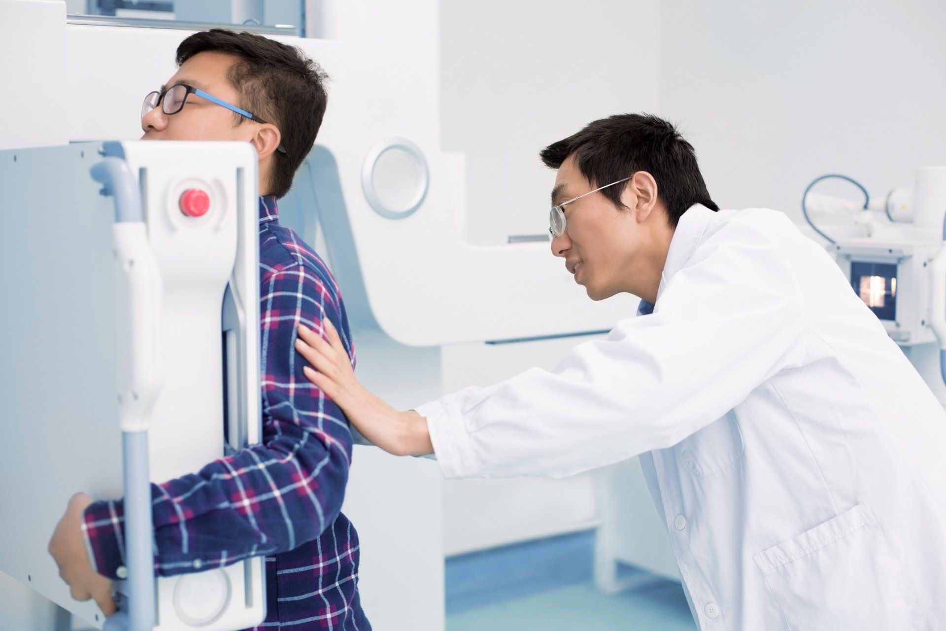 Man getting a chest x-ray — New Hartford, NY — Oxford Medical Imaging Man getting a chest x-ray — New Hartford, NY — Oxford Medical Imaging