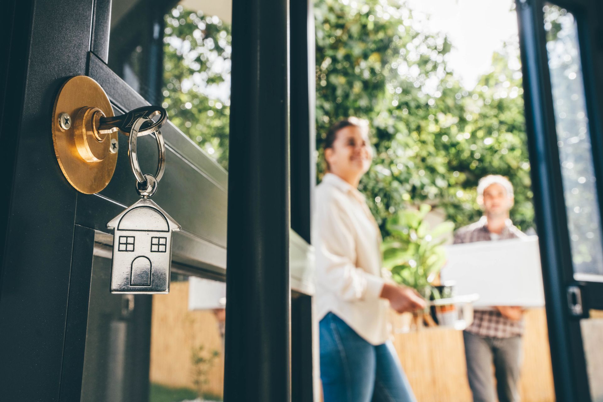 A keychain with a house on it is hanging on a door – Springfield, MO - Shirley Franklin Team A keychain with a house on it is hanging on a door – Springfield, MO - Shirley Franklin Team
