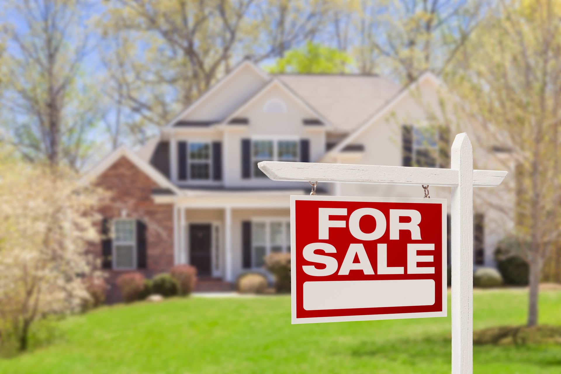 A for sale sign is in front of a house – Springfield, MO - Shirley Franklin Team