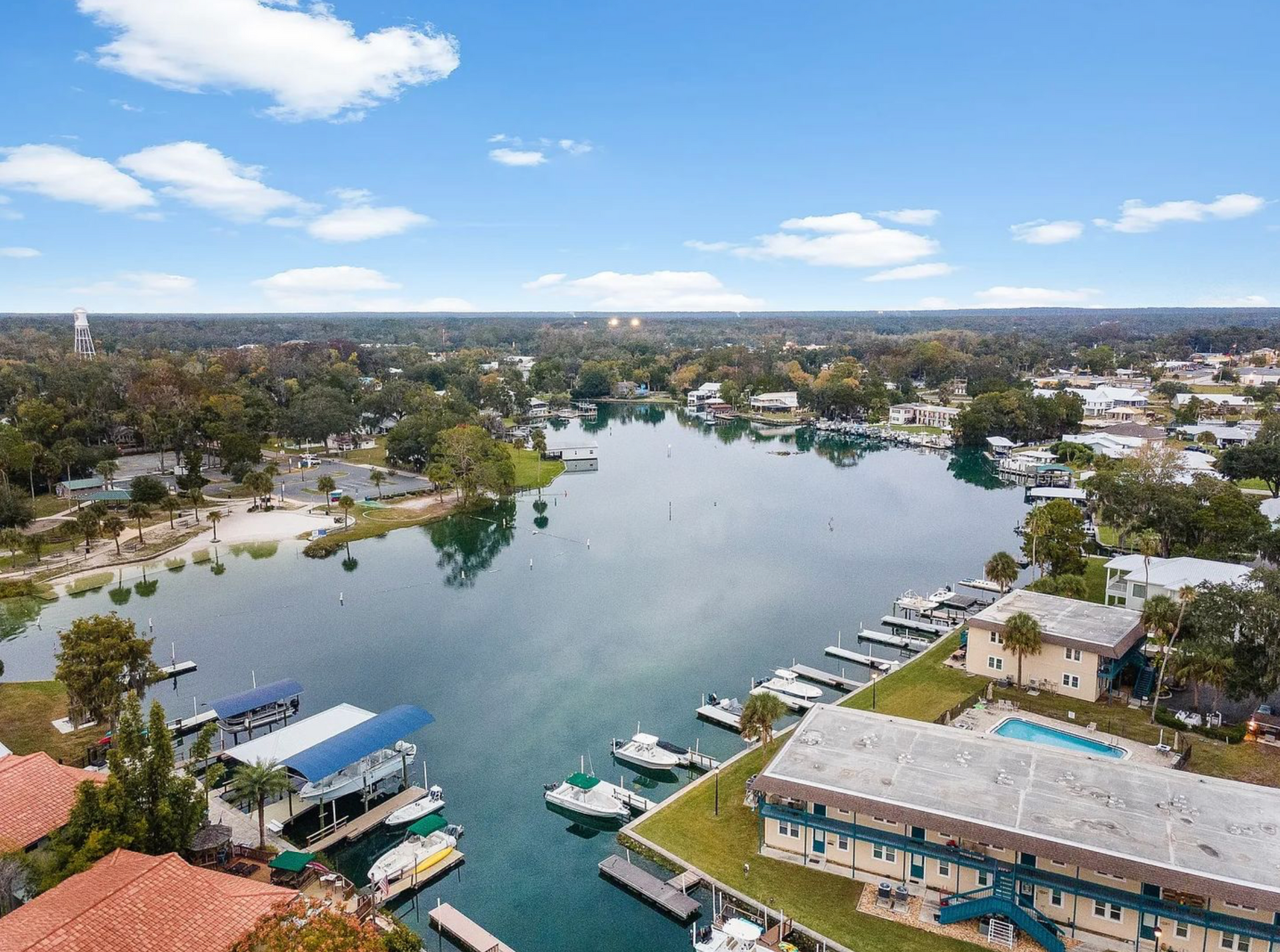 Out-of-state Florida rental-property owner reviewing an inspection report with a local property mana