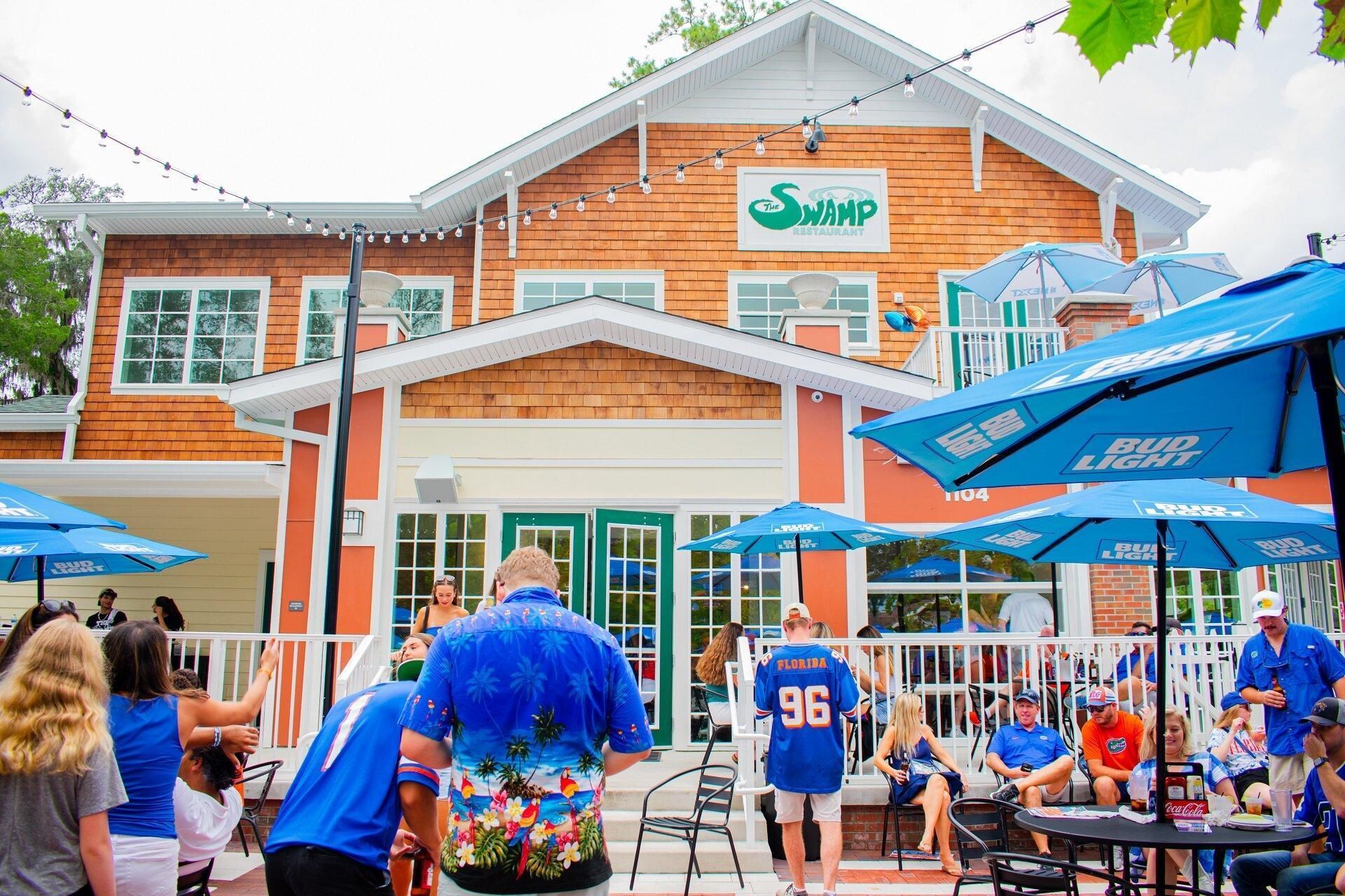Florida Gators fans watching football at a Gainesville Florida game-day gathering