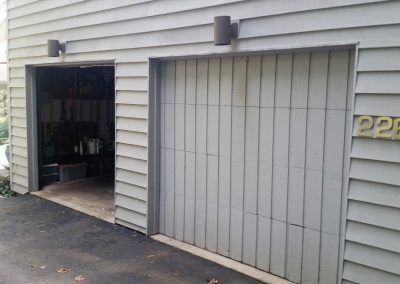 A garage door is open and a garage door is closed.