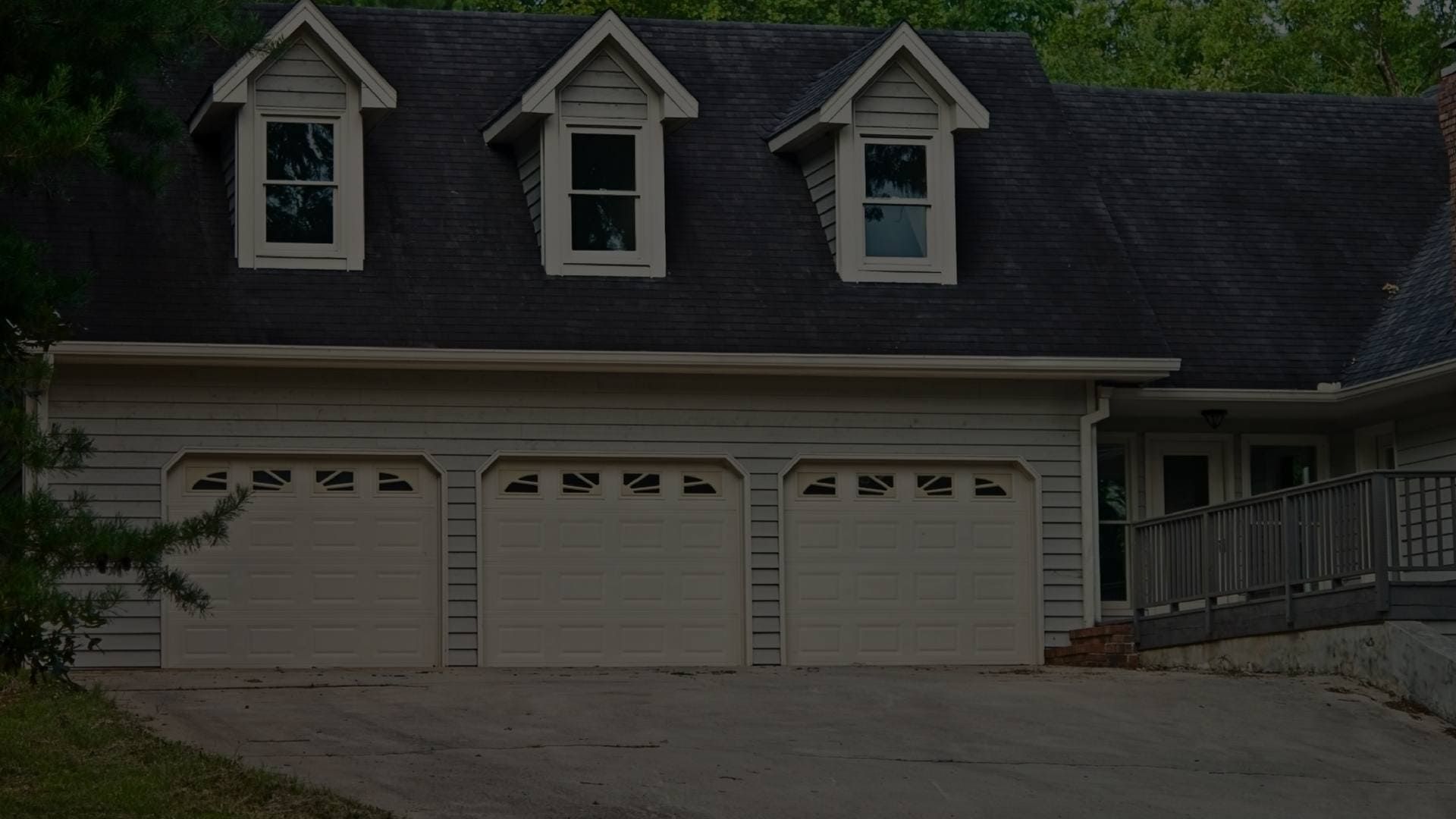 a blue and white house with a white garage door