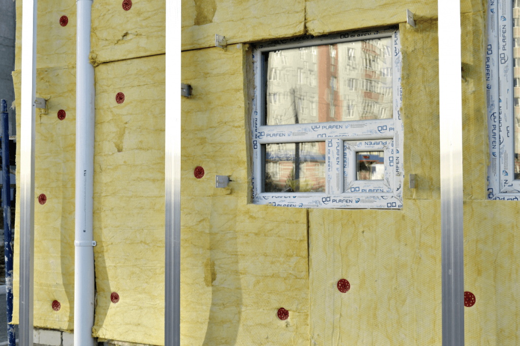 A building with a lot of insulation on it and a window.