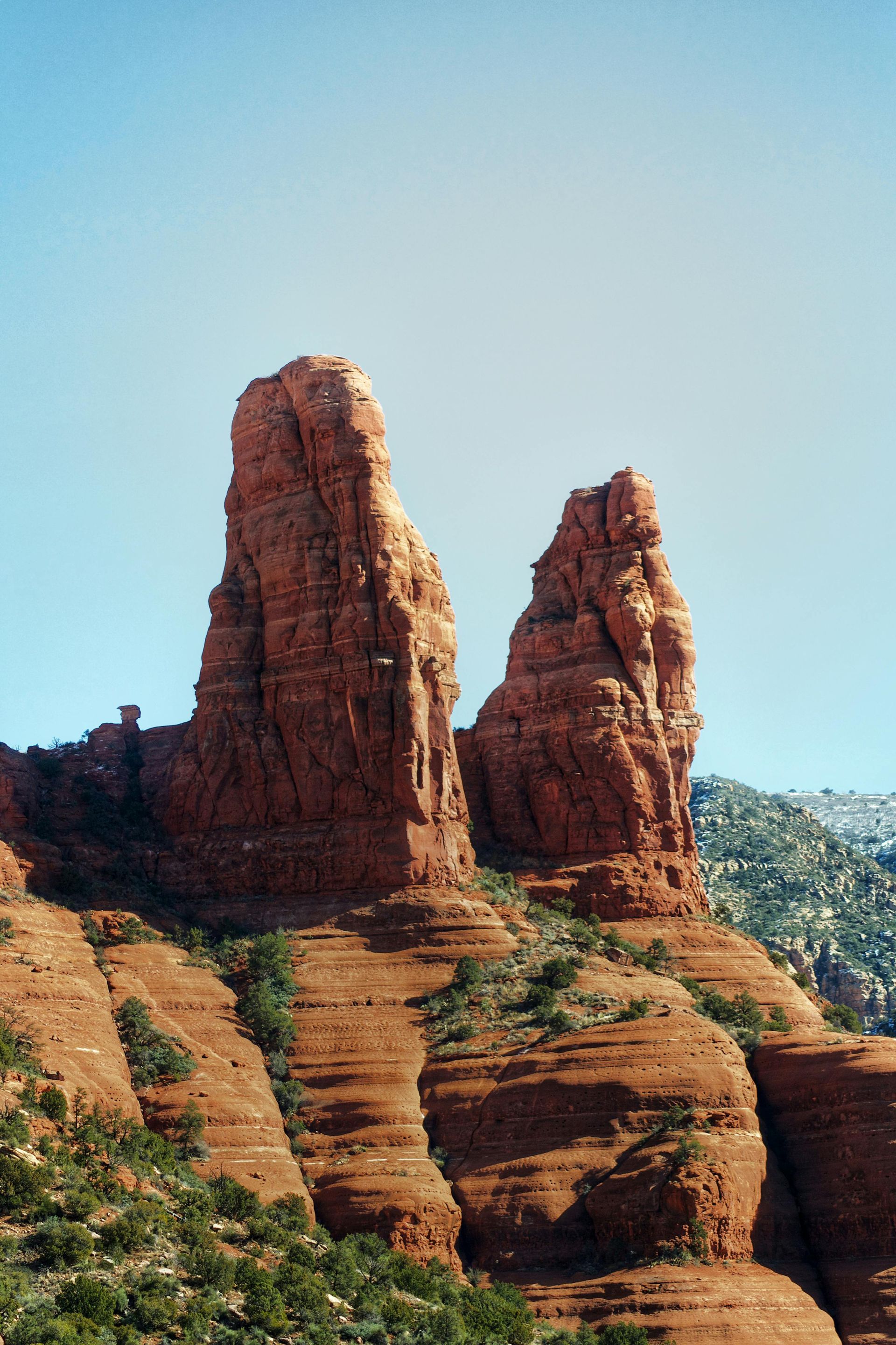 Red rock formations against a clear blue sky in Sedona, Arizona.