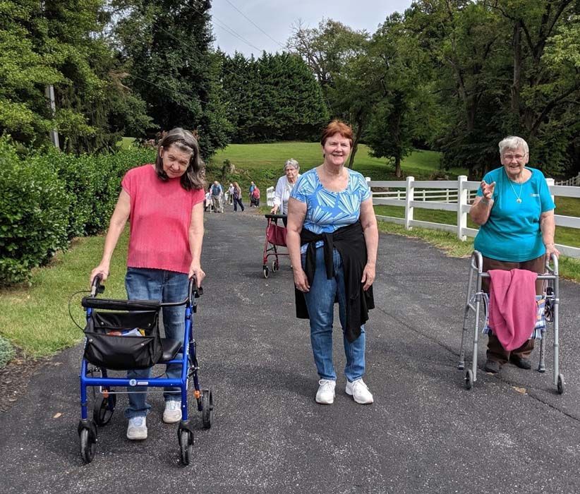 Young Woman Holding Elder Hands | Bel Air, MD | Jacob’s Well Assisted Living