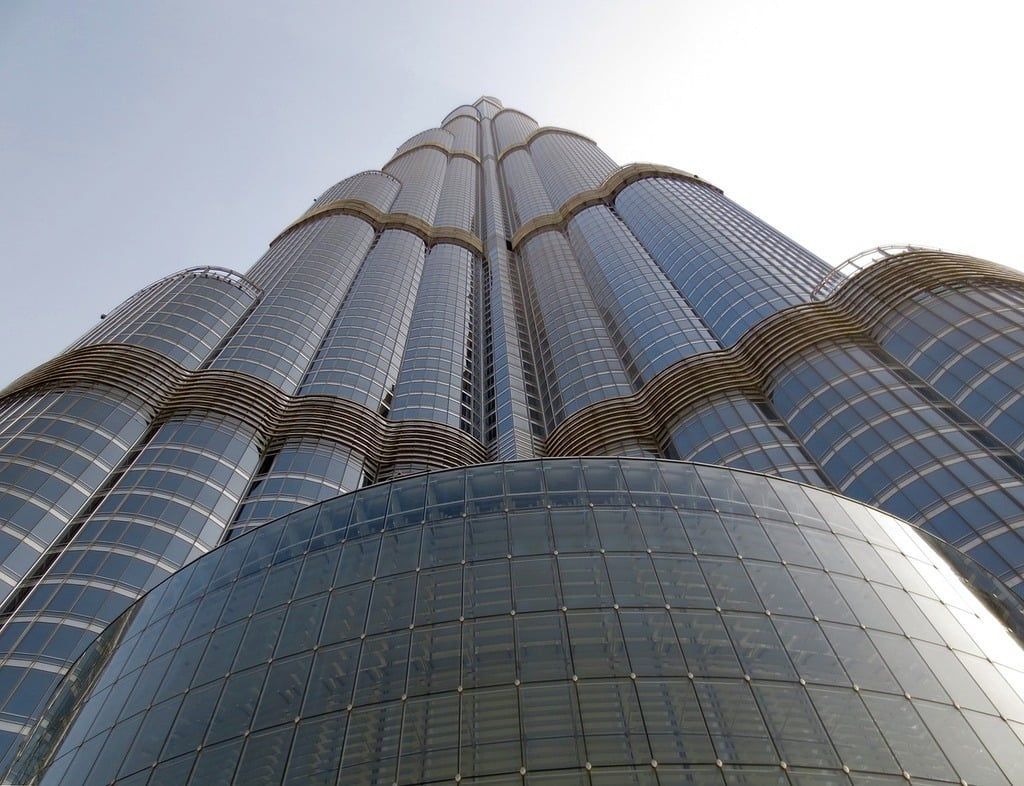 Burj Khalifa skyscraper, Dubai, rising to a point against a pale blue sky. Armani Hotel