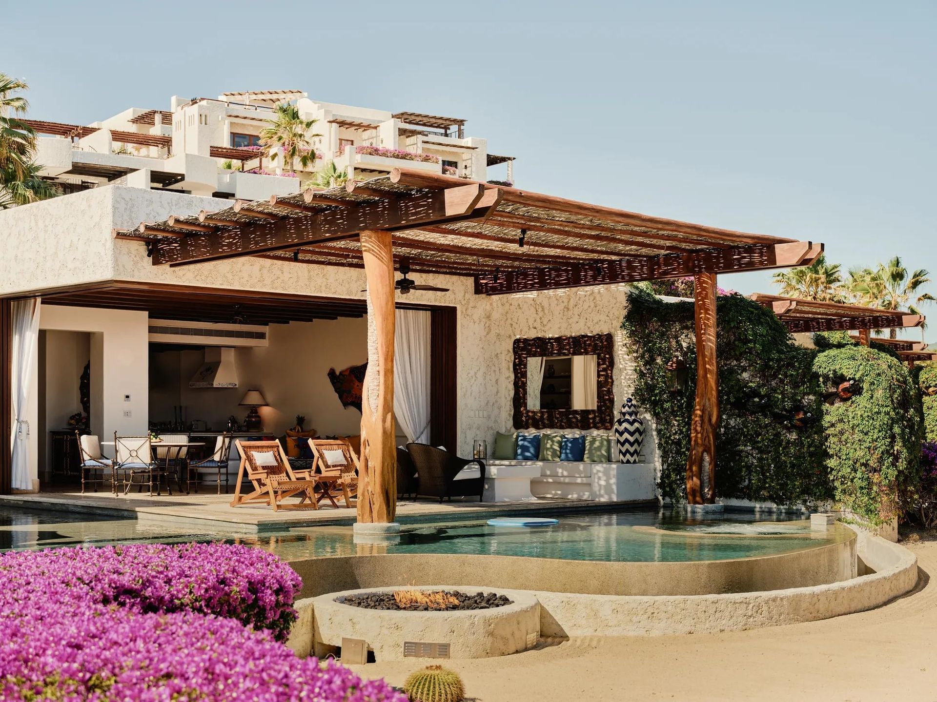 Luxury villa patio with pergola, pool, and flowering shrubs overlooking the sea Las Ventanas al Paraíso