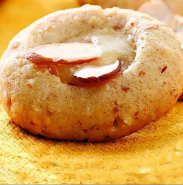 A close up of a cookie on a yellow surface