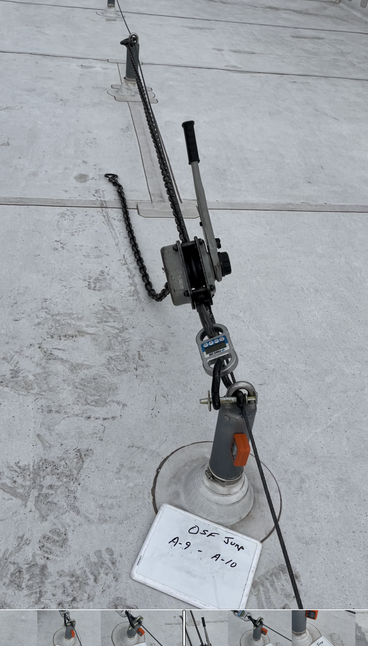 A piece of equipment is sitting on top of a concrete surface.