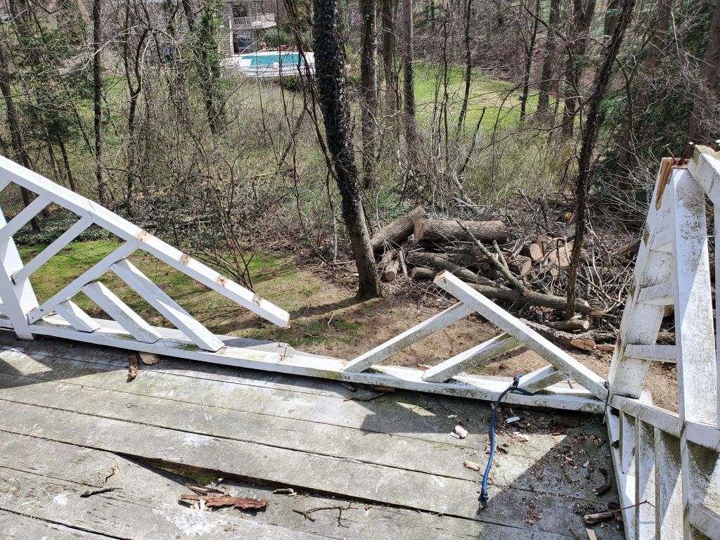 Damaged railing from the fallen tree.