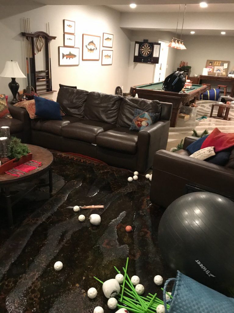 A living room filled with furniture and a pool table