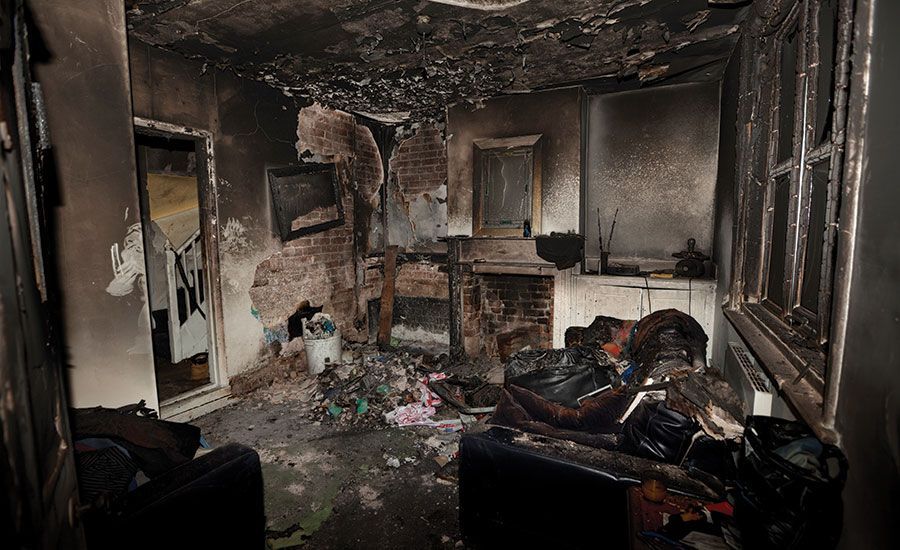 A living room that has been destroyed by a house fire. 