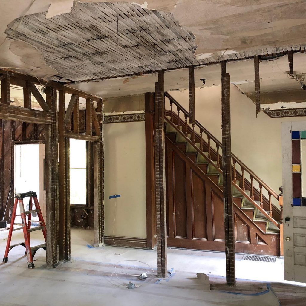 A room with a ladder and stairs in it