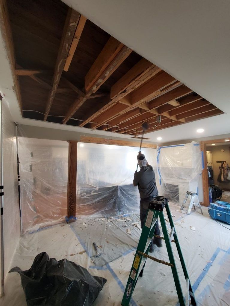 Shrock Restoration team member during the water damage restoration process.