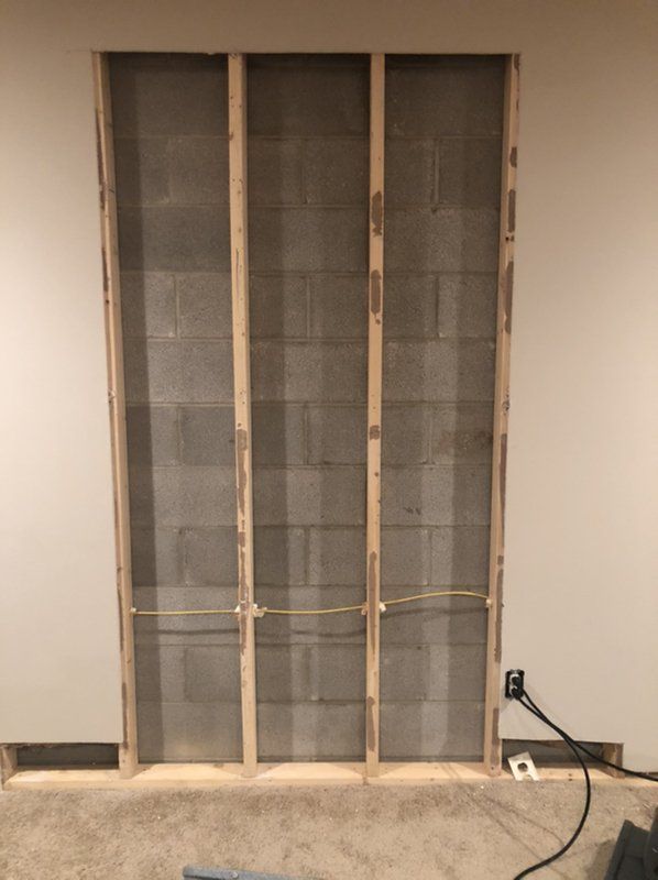 Brick showing through wall that is being remodeled.