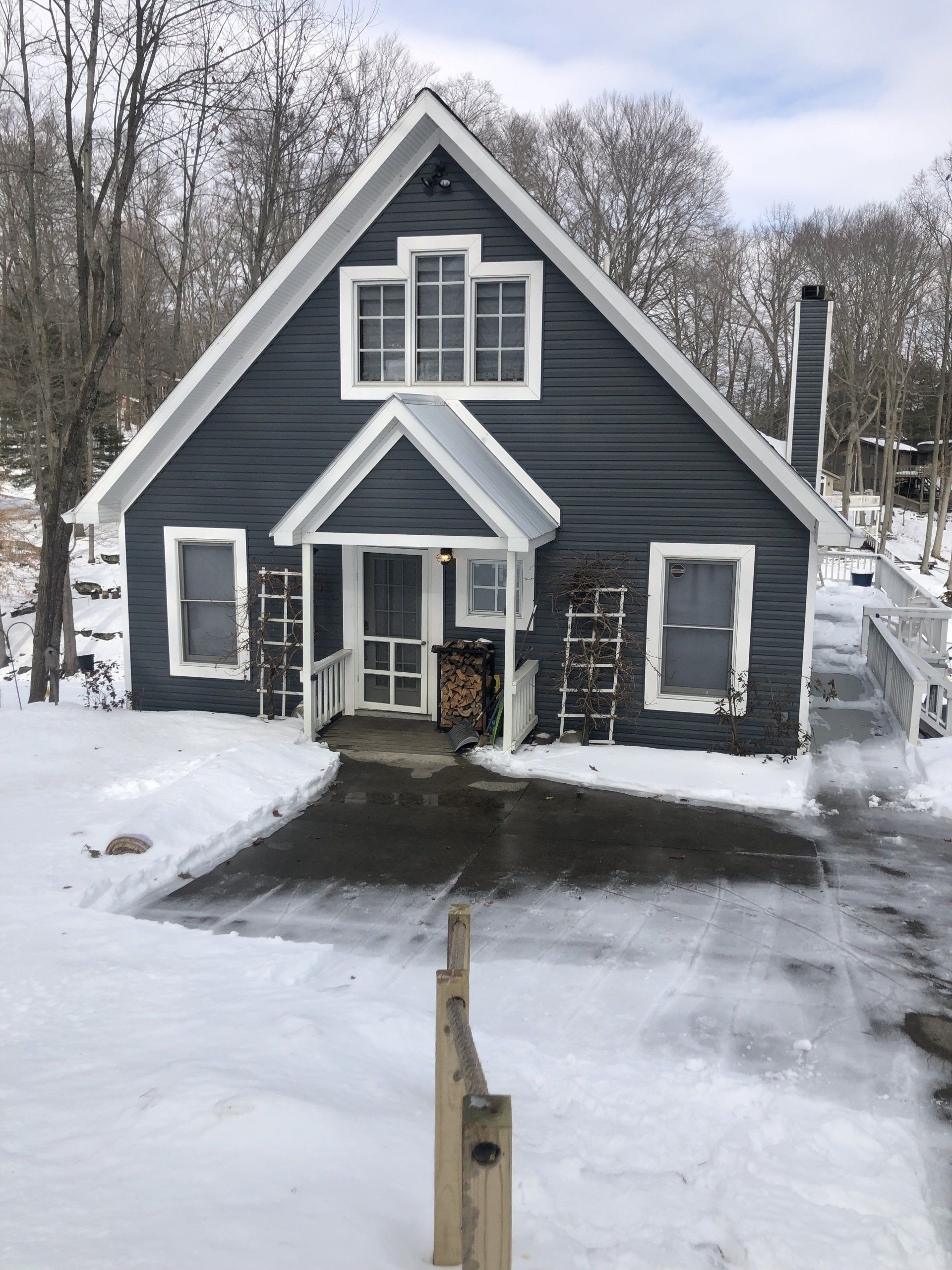 A house with windows is covered in snow.