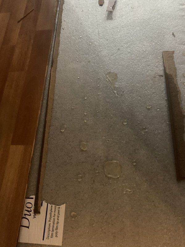 A floor with water damage from water heater.