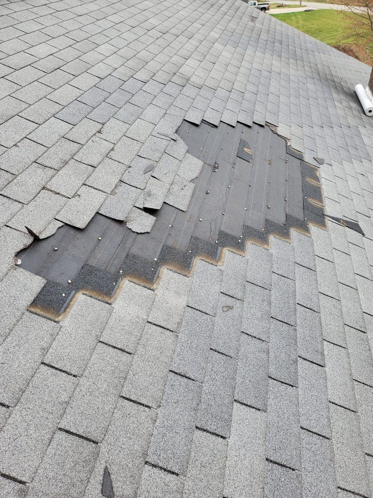Roof damage to the house in Dover, Ohio