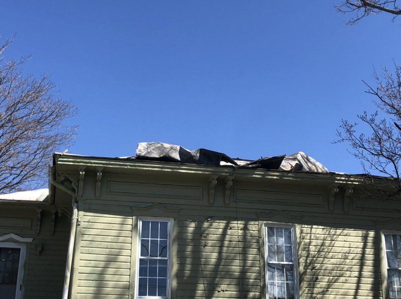 A down below picture of the damaged roof before restoration.