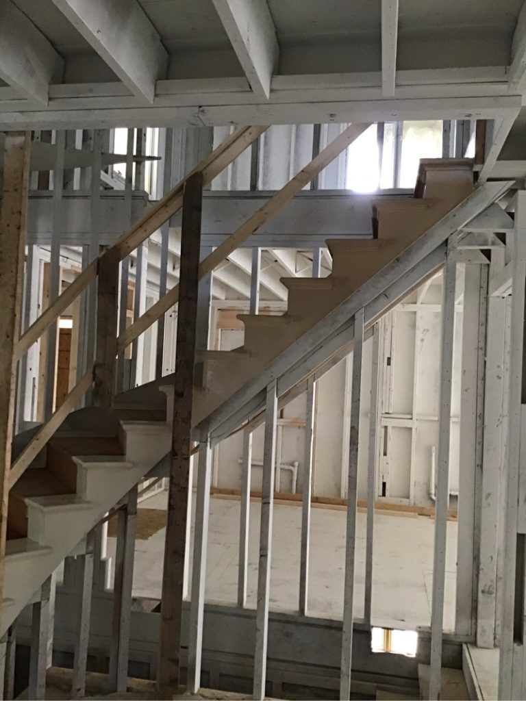 A staircase is being built in a house under construction.