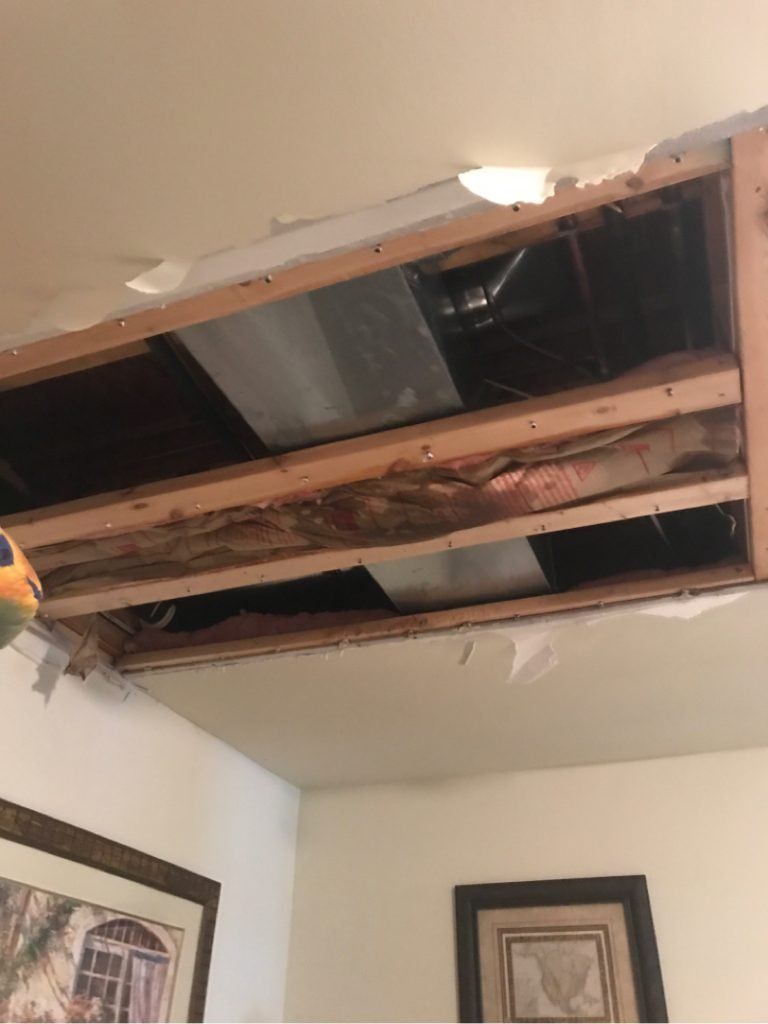 A damaged ceiling caused by water damage.