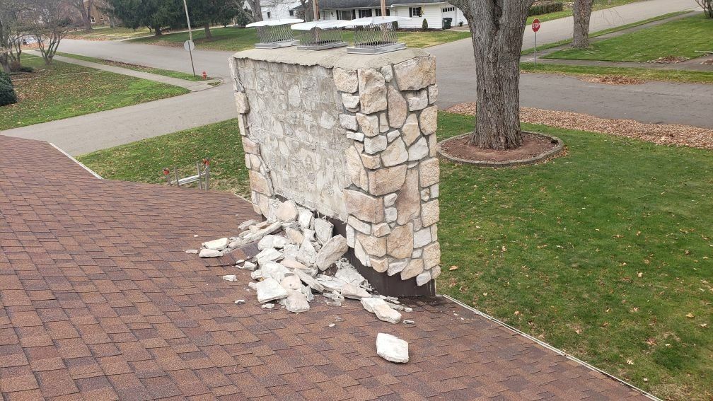 Chimney material crumbling where the chimney meets the roof.