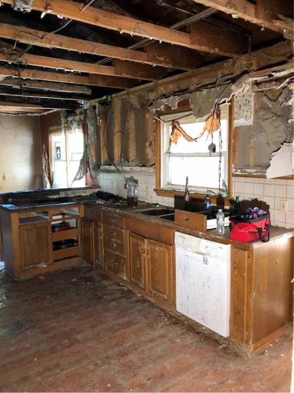 A kitchen in a house that is being remodeled.