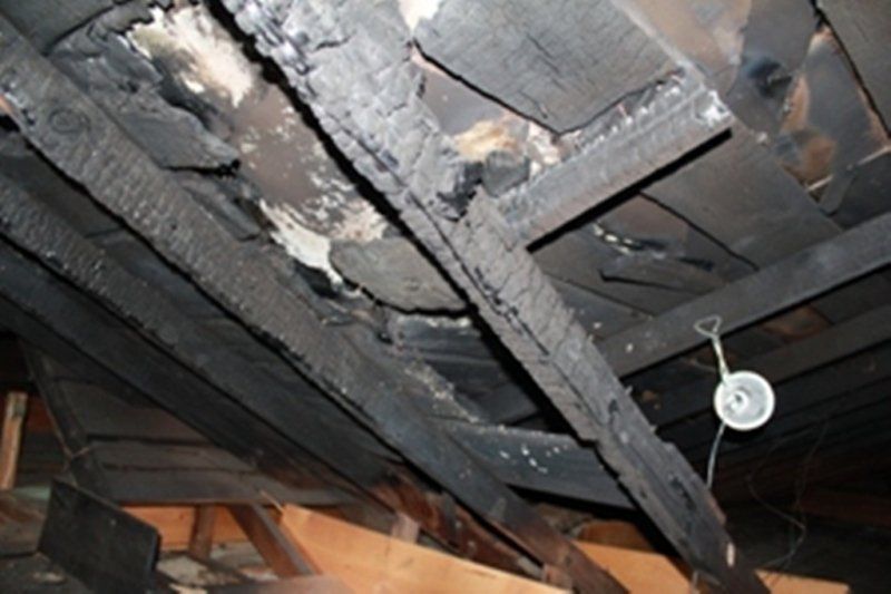 The ceiling of a house which has been damaged by a house fire.