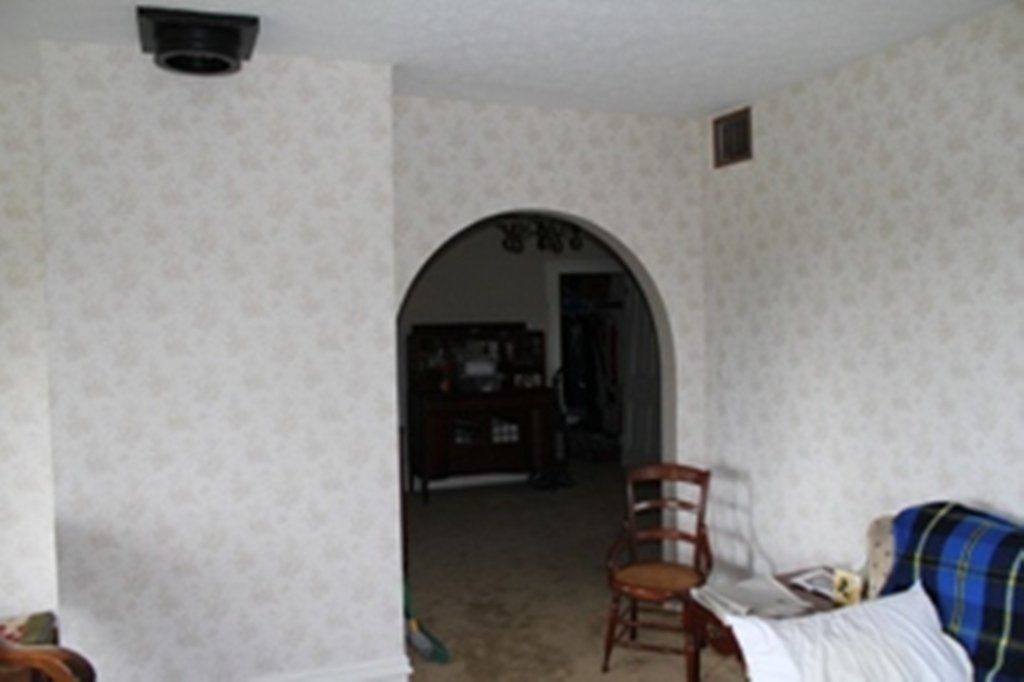 A living room with a chair and a couch