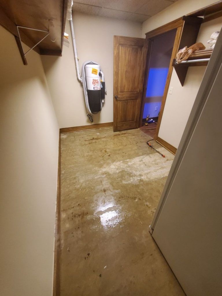 A room that has been damaged by sewer backup .